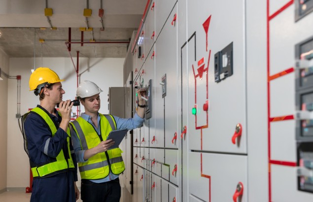 Commissioning engineer working within a live HV substation environment