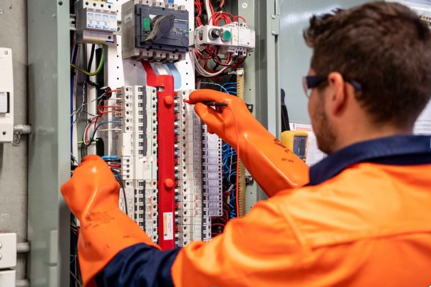 Commissioning engineer on-site at a utility-scale energy project